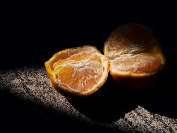 Close-up of lemon slices against black background