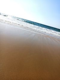 Scenic view of beach against clear sky