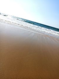 Scenic view of beach against clear sky