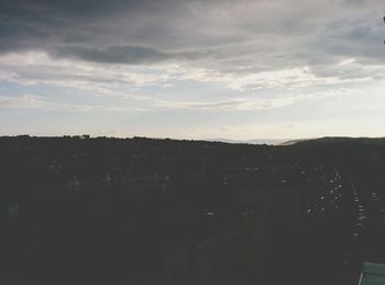 Scenic view of landscape against cloudy sky