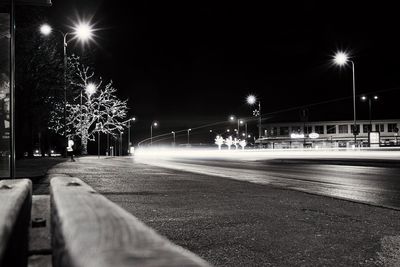 Illuminated light trails on road at night