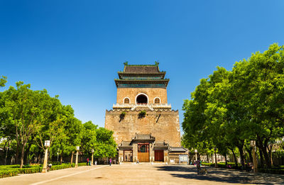 Low angle view of building against clear blue sky