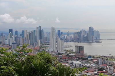 Modern buildings in city against sky