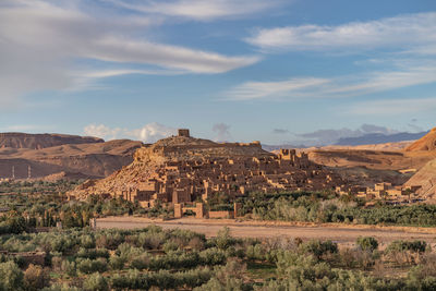 Scenic view of landscape against cloudy sky