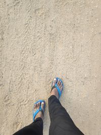 Low section of woman standing on ground