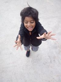 High angle view of smiling girl standing outdoors