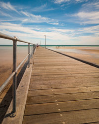 Pier over sea against sky