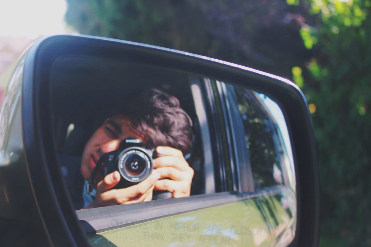 car, land vehicle, transportation, mode of transport, vehicle interior, side-view mirror, car interior, reflection, glass - material, close-up, transparent, sunglasses, photography themes, part of, holding, travel, focus on foreground, steering wheel
