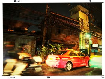 Illuminated city street at night