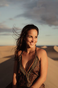 Portrait of a smiling young woman on beach