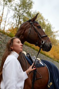 Rear view of people riding horse