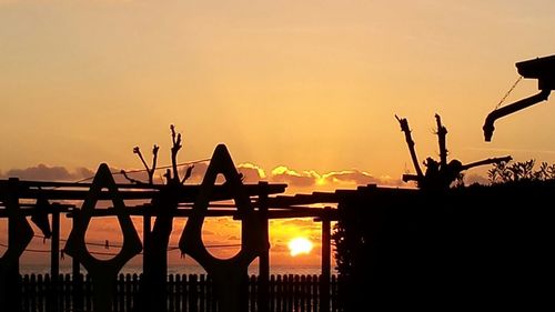 Silhouette of trees against sky during sunset