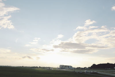 Scenic view of landscape against cloudy sky