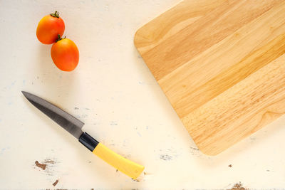 High angle view of oranges on cutting board