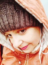 Close-up portrait of cute girl wearing hat