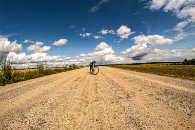 View of bicycle on road against sky