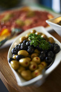 Close-up of fruits in plate on table