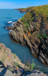 High angle view of rocks on beach against sky