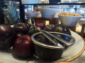 Close-up of fruits in plate on table at restaurant