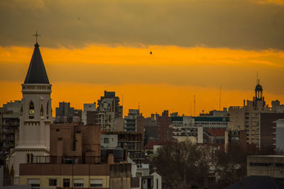 View of buildings against sky during sunset