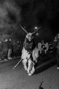 People on street during traditional festival at night