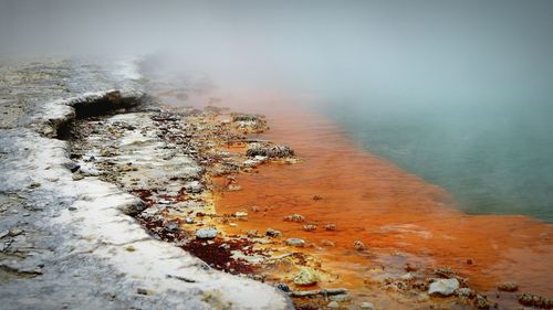 High angle view of steam over hot spring