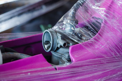 Close-up of pink glass container