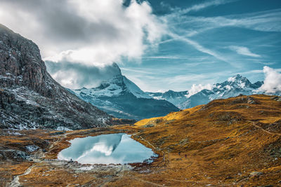 Panoramic view of matterhorn peak, switzerland. matterhorn reflection in the riffelsee.