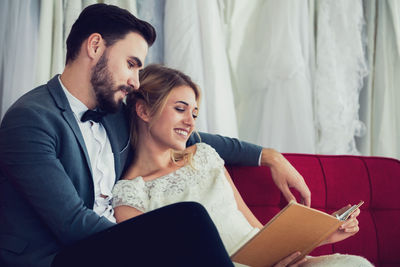 Young couple sitting in a room