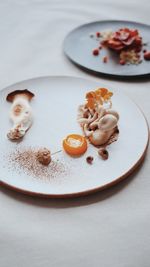 High angle view of fruit in plate on table