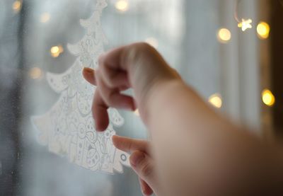 Midsection of person holding illuminated lighting equipment