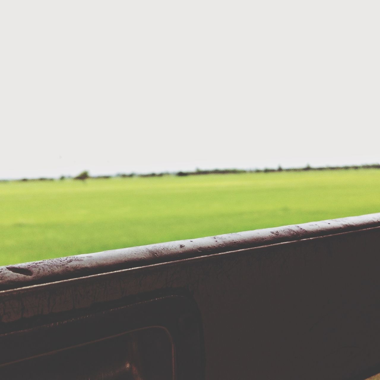 clear sky, copy space, field, landscape, grass, rural scene, transportation, agriculture, tranquil scene, green color, nature, road, tranquility, farm, growth, day, no people, outdoors, beauty in nature, sky