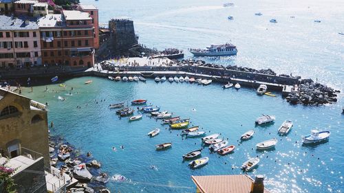 High angle view of boats moored at harbor