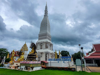 View of temple building against cloudy sky