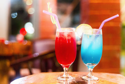 Close-up of wine glasses on table