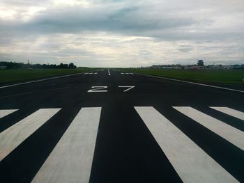 Road against cloudy sky