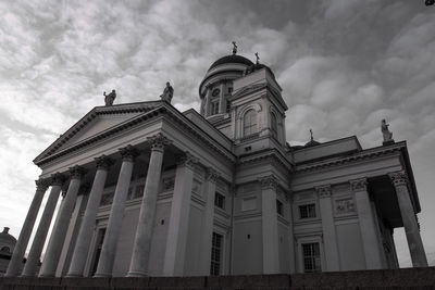 Low angle view of building against cloudy sky