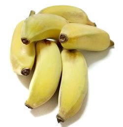 Close-up of bananas against white background