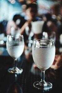 Close-up of drink glasses on table