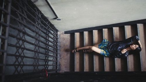 Woman standing against wall