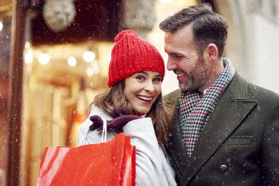 Portrait of smiling young woman in snow