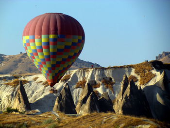 Close-up of multi colored rocks against blue sky