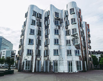 Exterior of buildings in city against sky