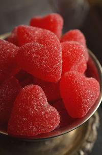 Silver dish full of sugar coated red jelly heart candy