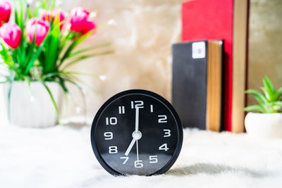 Close-up of clock on table