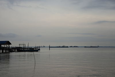 Scenic view of sea against sky at sunset