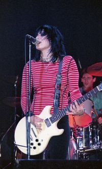 Young woman playing guitar