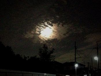 Low angle view of silhouette trees against sky at night