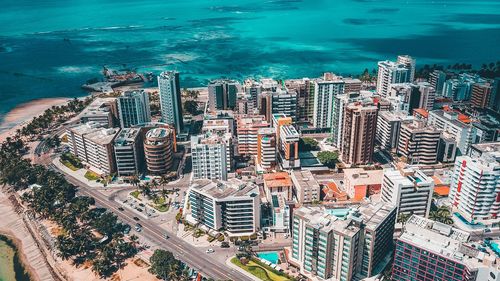 High angle view of city by sea