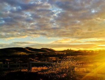 Scenic view of mountains against cloudy sky
